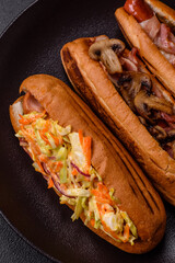Hotdog with grilled sausage with cabbage, carrots and onions
