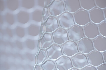 Close-up of silicone mesh cells. Fishing landing net close up.