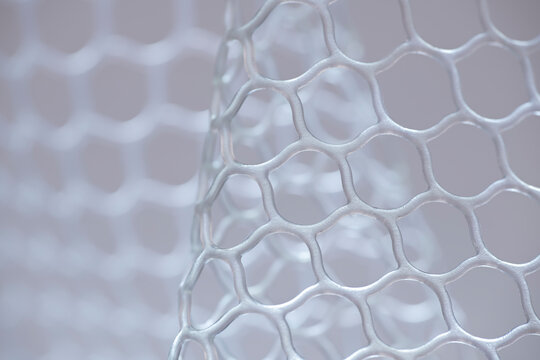 Close-up of silicone mesh cells. Fishing landing net close up.