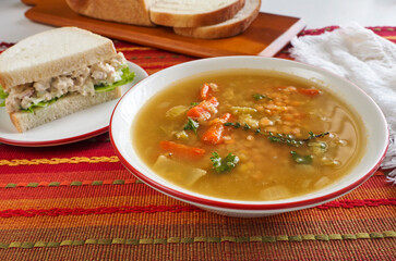 Lentil Soup and Chicken Salad Sandwich on Red Horizontal