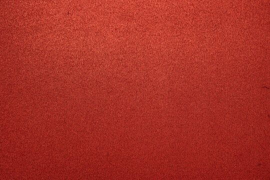 fondo texturizado de goma eva roja granulada y brillante