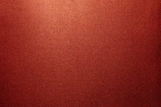textura granulada roja de goma eva brillante iluminada para fondos