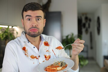 Grotesque looking adult eating without manners 