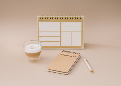 Trendy layout with weekly planner, coffee and pen on beige background. Planner for organization and goal priorities. Writing down tasks and schedule reminders on office desk. Minimal creative concept.