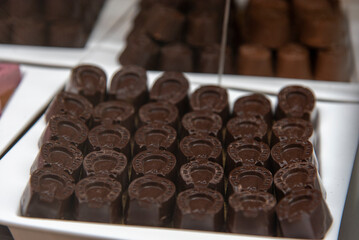 A tempting assortment of gourmet chocolates on a decorative plate