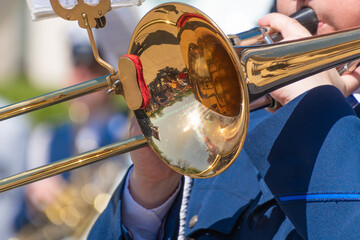 Fototapeta premium a brass band musician playing the trombone