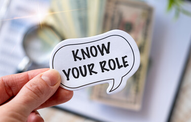 Know Your Role written on a memo stick in hand. Inspiration.