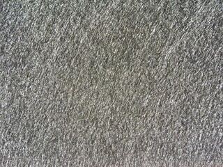The textured surface is gray as a background. Felt. High quality photo