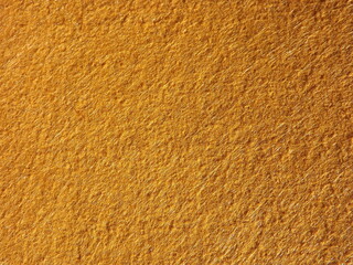 The textured surface is brown, red in color as a background. Felt. High quality photo