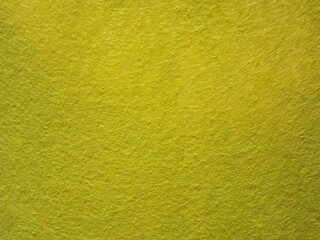 The textured surface is green, light green, pistachio color, herbal color as a background. Felt. High quality photo