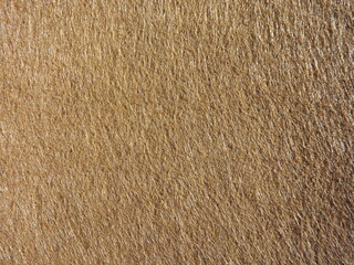The textured surface is brown, red in color as a background. Felt. High quality photo