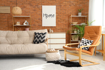 Interior of living room with couch, armchair and shelf units