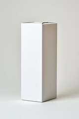 Naklejka premium A white cardboard box with a white lid. The box is empty and has no writing on it