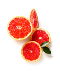 Cut fresh grapefruit and leaves on white background