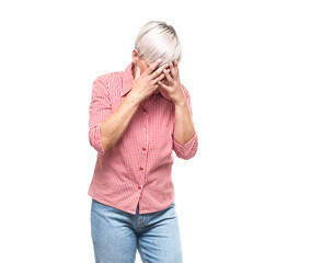 Sad middle aged woman holding her hands on his face, isolated on white background. Emotional hurt...