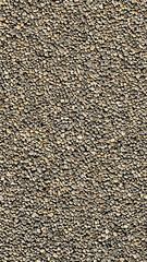 A close up of a pile of rocks. The rocks are of various sizes and are scattered all over the image. Scene is calm and peaceful, as the rocks seem to be resting in a natural setting
