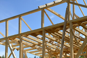 Wooden roof frame house construction. Roofing construction.
