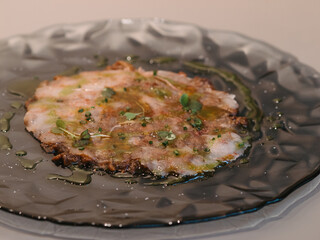 a plate of prawn carpaccio