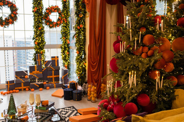 The interior of the Scandinavian-style living room, decorated for the Christmas holidays. Christmas presents near big window.