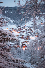 Grindelwald, under the soft glow of the night lights, transforms into a magical village where the...