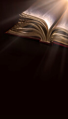 Dark table with open bible