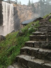 As carved steps and stairs in the rocks, the Mist Trail leads hikers towards Vernal Falls in Yosemite National Park
