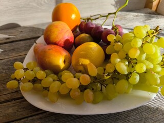 juicy fresh grapes next to fruits