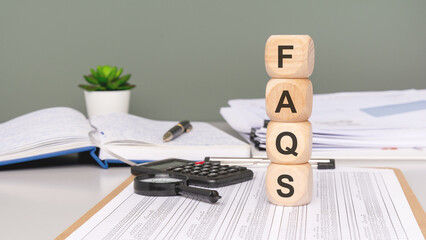 Frequently Asked Questions About Blocks on Desks with Various Office Supplies and Notebooks