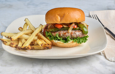 sausage burger  top with  sauteed onions and peppers