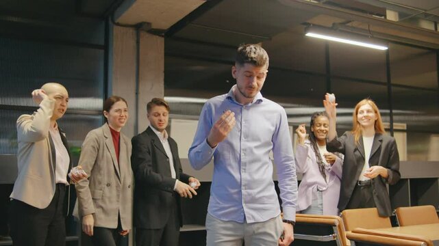 A sad businessman faces bullying and humiliation from colleagues who throw paper at him, showing office tensions and workplace conflict.