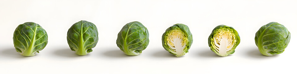 Fototapeta premium Healthy Green Brussels Sprouts Row Arrangement. White Background. 