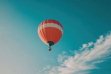 Naklejka premium Hot Air Balloon Floating in Clear Blue Sky