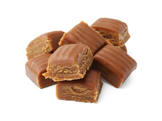 Tasty sweet caramel candies isolated on white