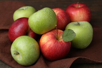 Many fresh ripe apples on table, closeup