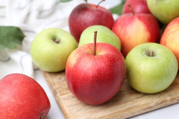Many fresh ripe apples on table, closeup