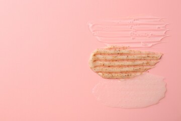 Samples of cosmetic products on pink background, top view. Space for text. Skin care