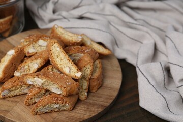 Traditional Italian almond biscuits (Cantucci) on wooden table, closeup