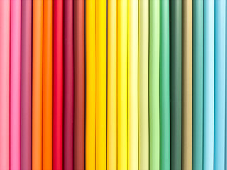 Obraz premium A row of colorful paper tubes, each one a different color