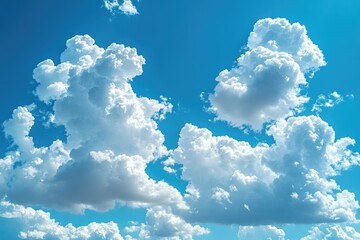 Naklejka premium Large, Fluffy Cumulus Clouds Against a Clear Blue Sky