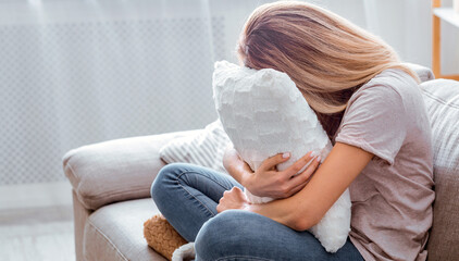 2019-ncov panic. Girl covered face pillow, stay at home