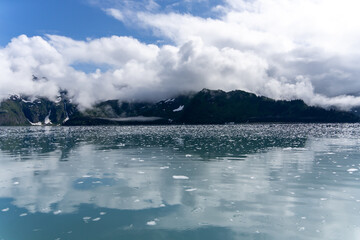 Serene Glacial Lake Surrounded by Snow-Capped Mountains