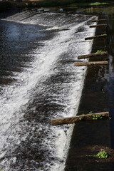 water flowing over the river in Malestroit, France 