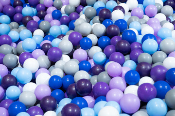 Purple blue and grey plastic balls.