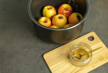preparing apples for baking with honey and nuts in a slow cooker