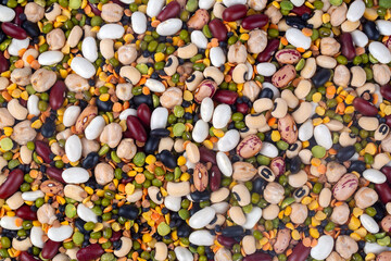 Mixed dried legumes and cereals isolated on white background