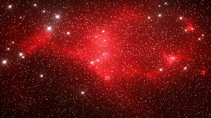 A stunning view of a vibrant red nebula surrounded by sparkling stars in deep space.