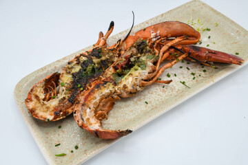 A grilled lobster cut in half