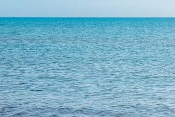 The blue calm water of Lake Michigan off the shore of Kohler-Andrae State Park, Sheboygan, Wisconsin in eawrly November