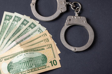 handcuffs and money