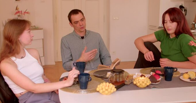 Persuasion and Influence: body language show attempt to persuade or convince others, using gestures to reinforce arguments and convey confidence. Three friends discussing while enjoying refreshments. 